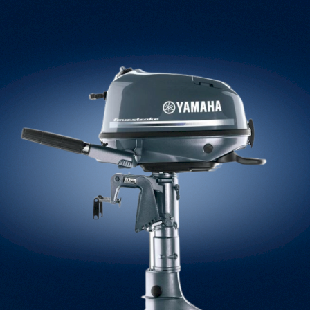 A Yamaha outboard motor mounted on a boat engine, dark blue background, chrome and black components, brand name visible.