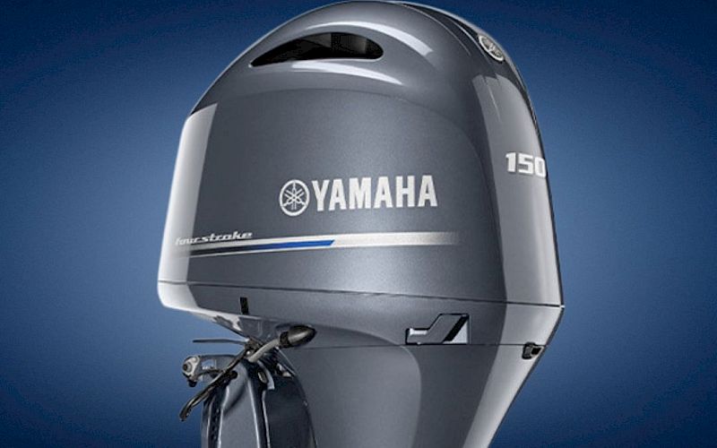 A Yamaha 150 outboard boat motor, close-up on the engine cowling against a blue background.
