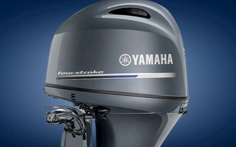 A Yamaha outboard boat engine/sterndrive with the &ldquo;YAMAHA&rdquo; logo against a blue background.