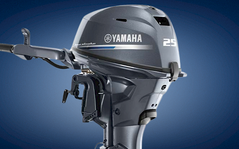Yamaha 25 outboard boat motor on a blue backdrop.